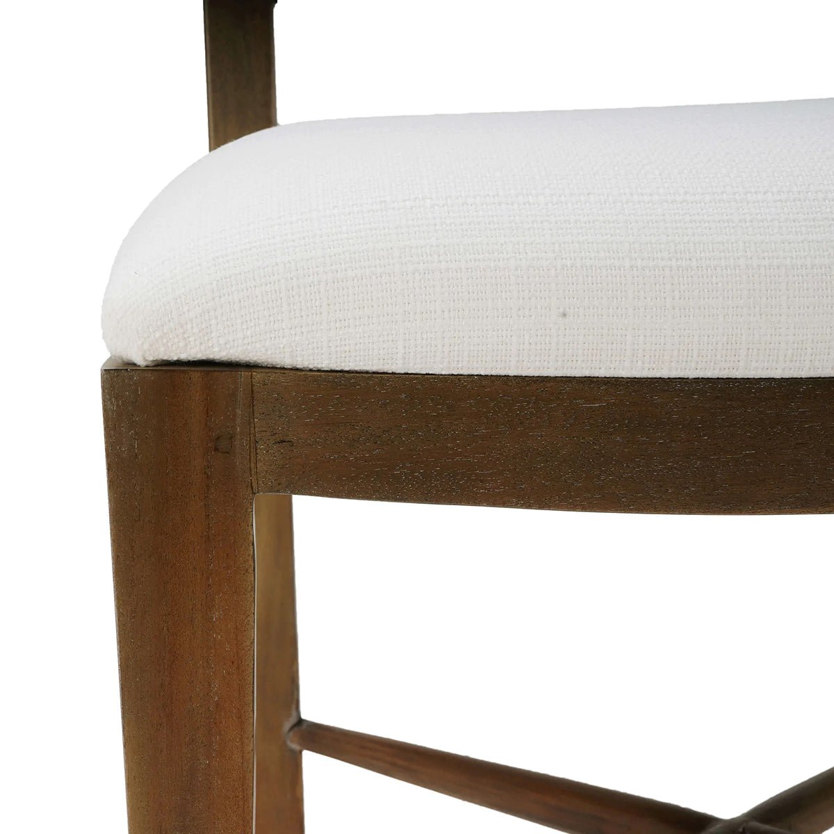 Upholstered chair seat close-up, textured fabric and wood joint.