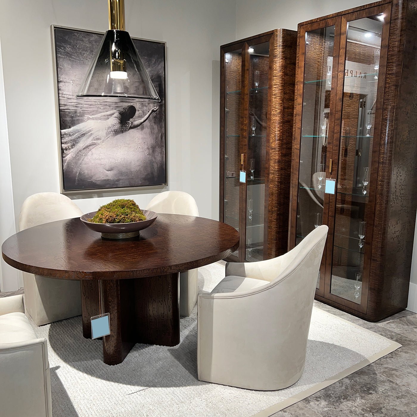 Beige dining chairs around table in elegant dining room.
