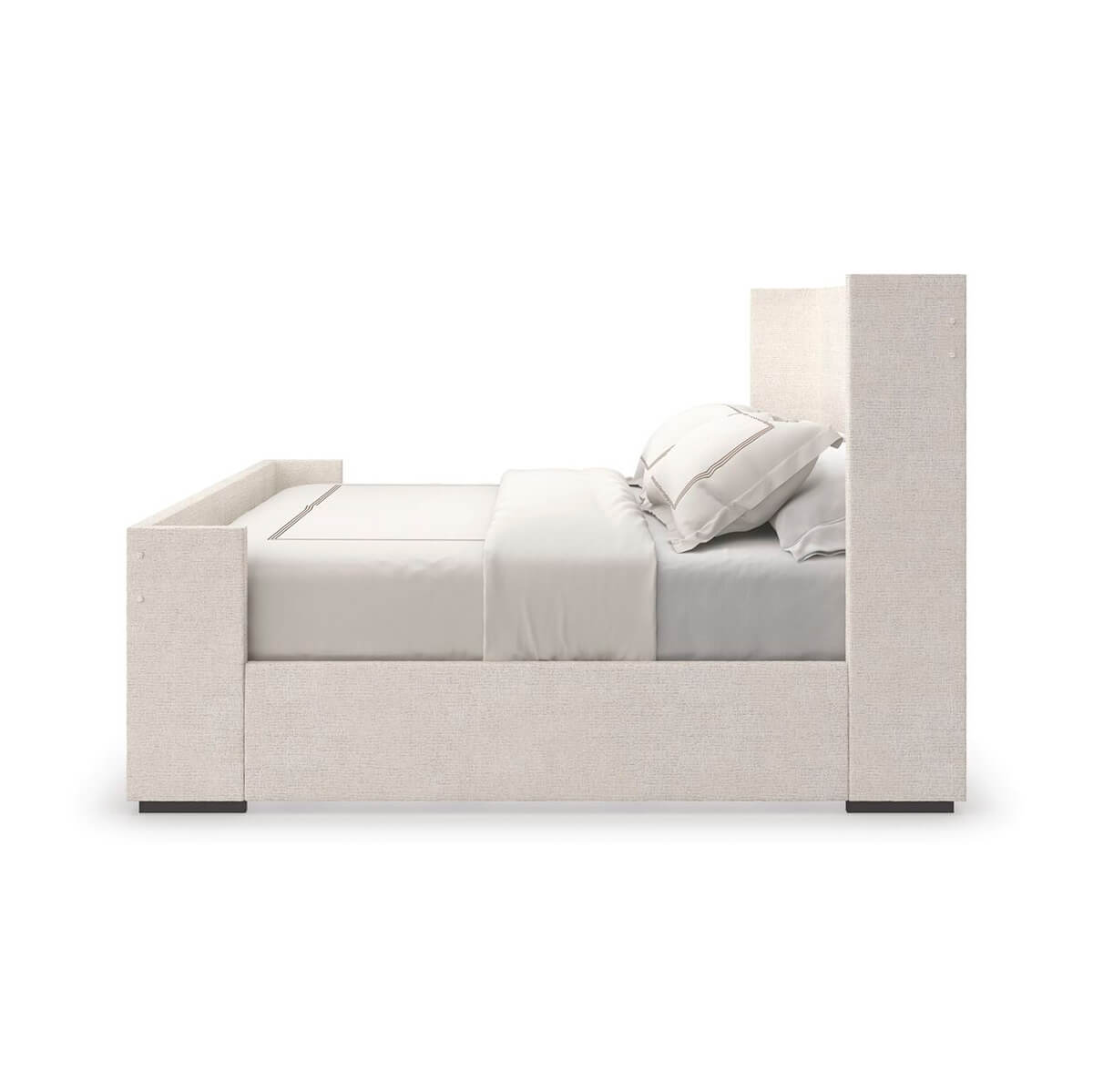 Side view of upholstered king size minimalist bed.