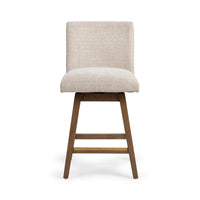 Front view of the cream fabric swivel counter stool with its straight padded back and brown wood base