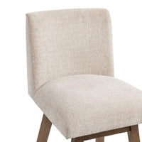 Detail of the cream textured fabric on the padded seat and straight backrest