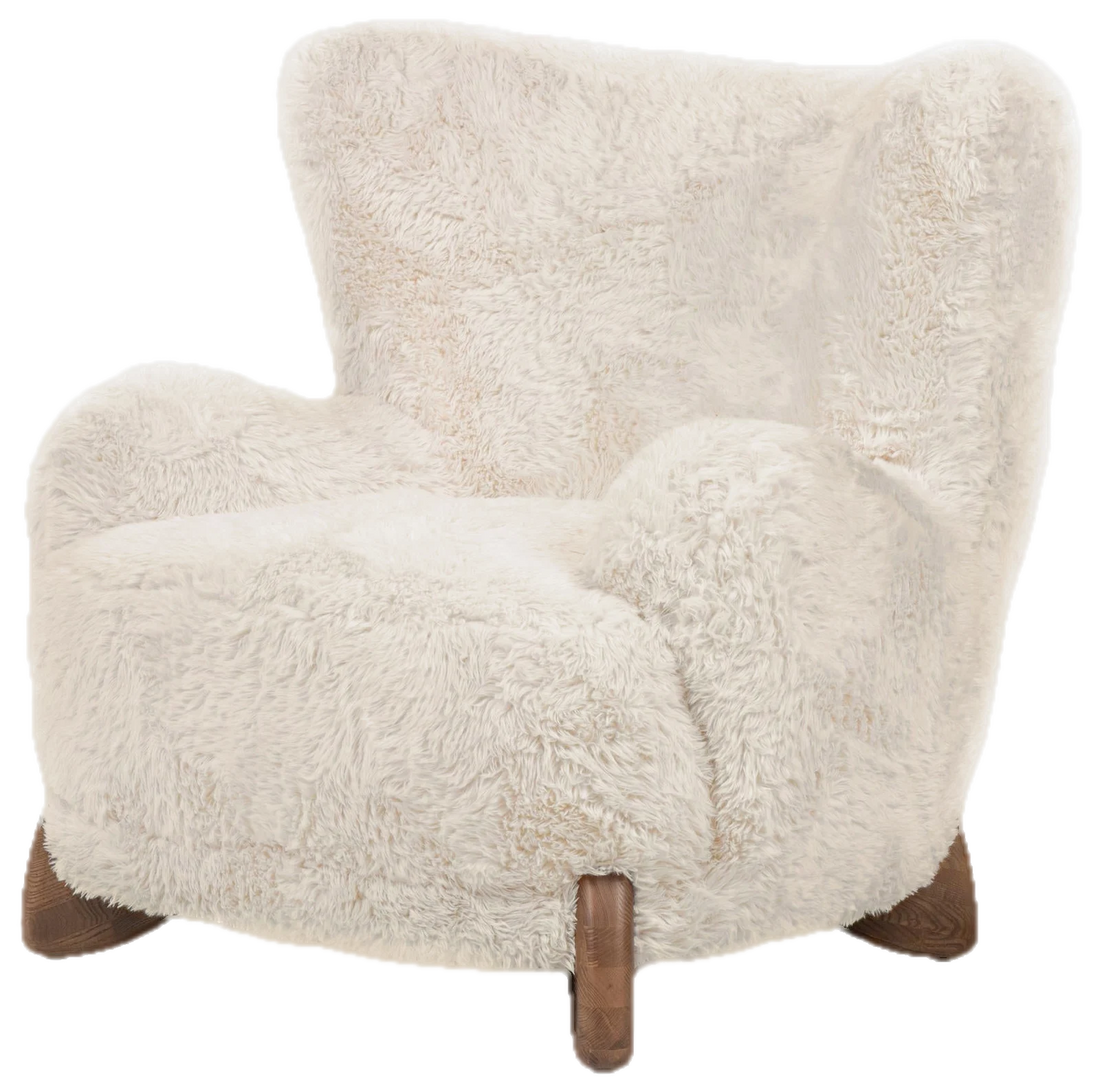 The Vanilla Wingback, an oversized wingback chair in long-pile vanilla upholstery on shaped ash feet