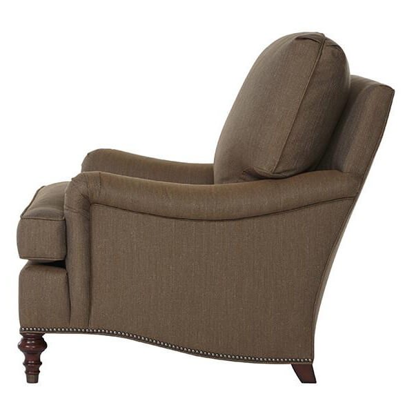 Brown Victorian-style armchair, side view elegant silhouette.