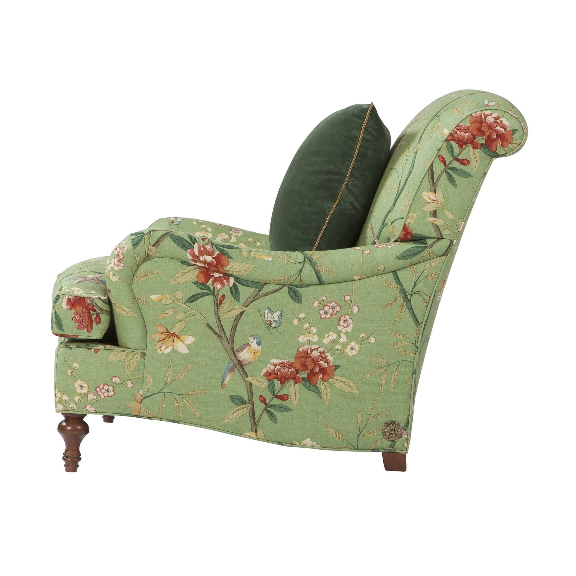 Green floral Victorian-style armchair, side view floral design.