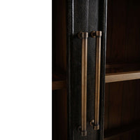Close-up of cabinet handles on vintage black display cabinet.