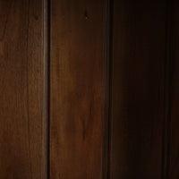 Interior wood texture of vintage black display cabinet.