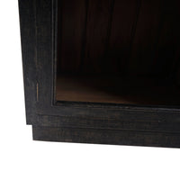 Bottom corner detail of vintage black display cabinet.