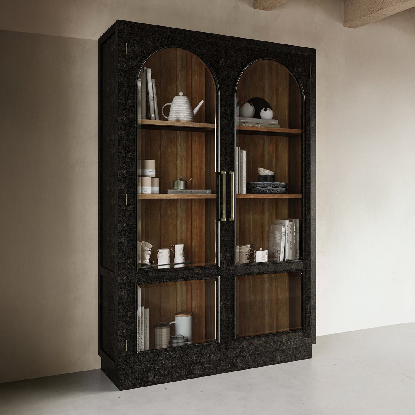Vintage black display cabinet filled with decor items.