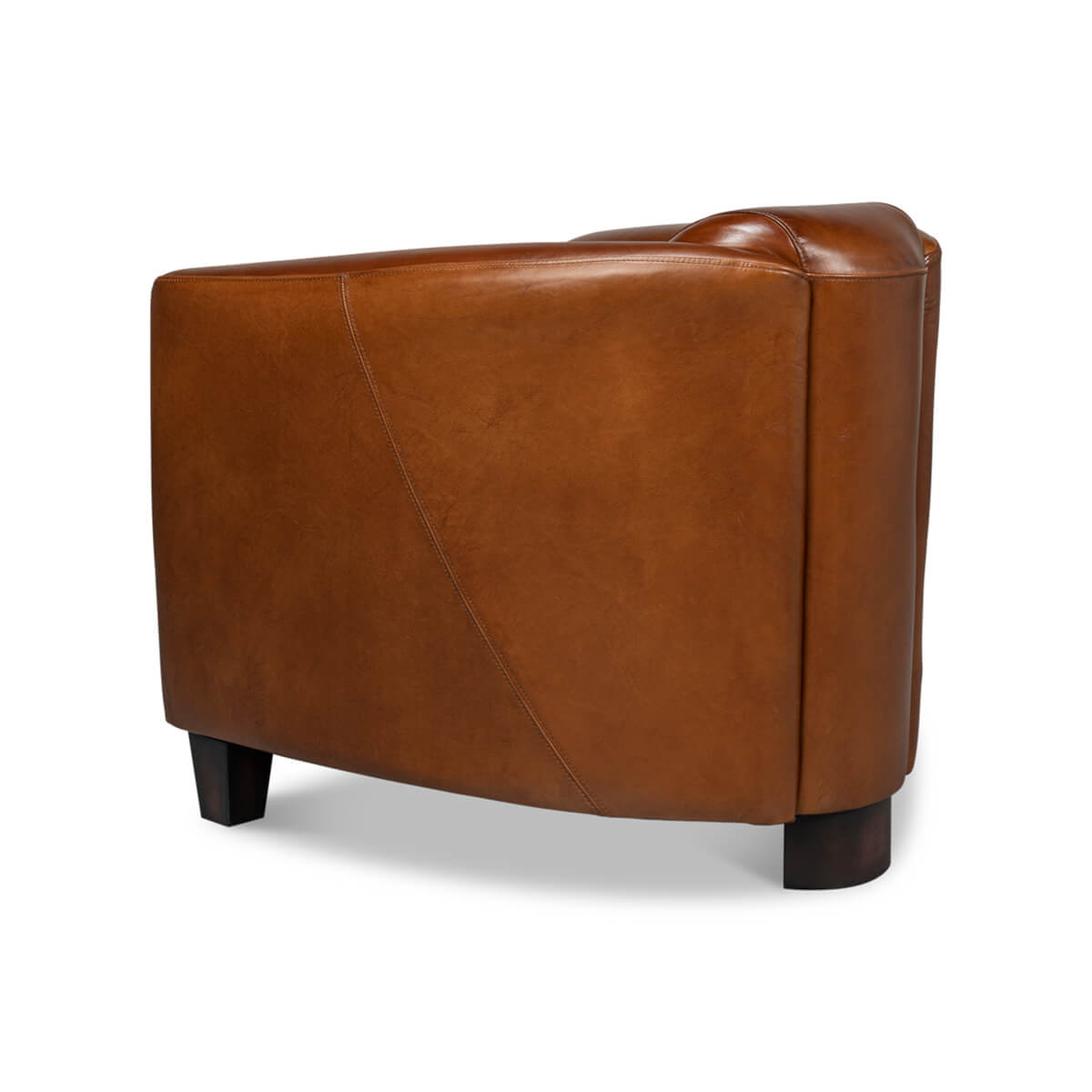 Brown leather club chair, side view.