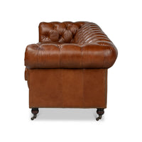 Vintage style Chesterfield sofa, side view.