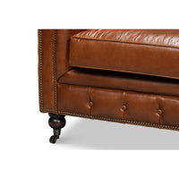 Vintage style Chesterfield sofa, corner and leg detail.