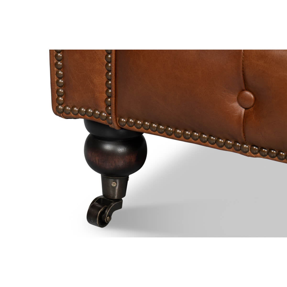 Vintage style Chesterfield sofa, caster wheel detail.