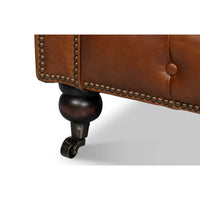 Vintage style Chesterfield sofa, caster wheel detail.