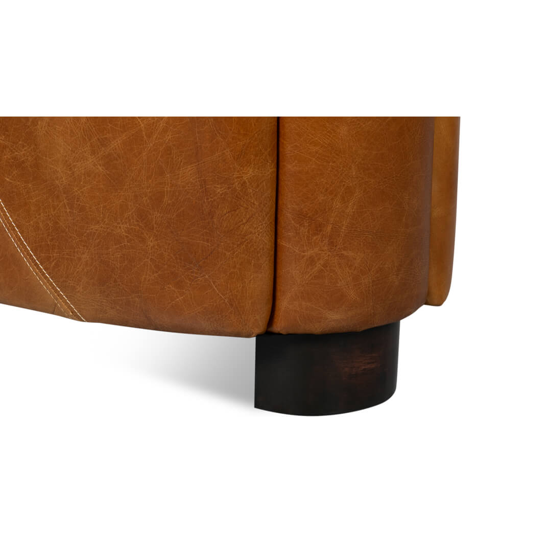 Brown leather club chair back leg detail