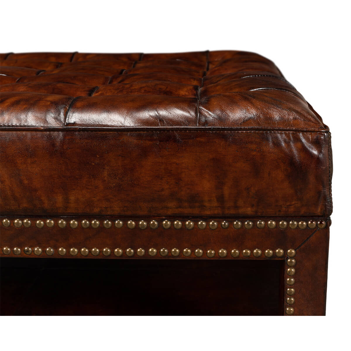 Close-up of ottoman corner detailing and upholstery.