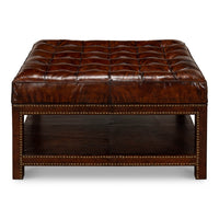 Front view of vintage-style leather ottoman.