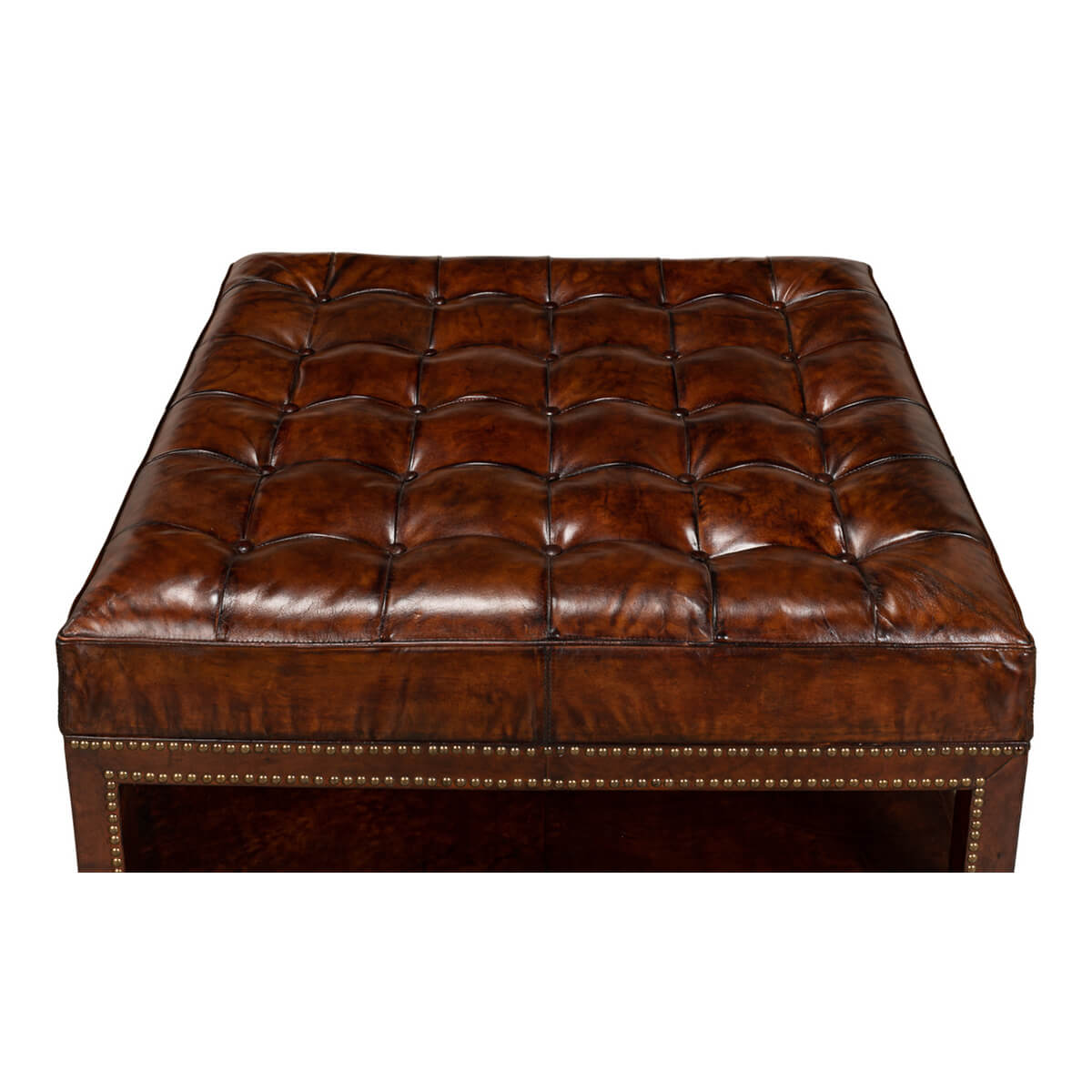 Top view of tufted leather ottoman details.