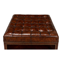 Top view of tufted leather ottoman details.