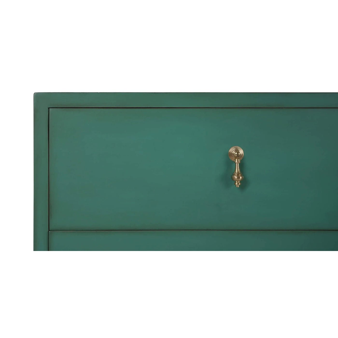Close-up of single drawer on vintage green dresser.