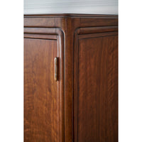 Corner detail of walnut Art Deco cabinet with visible hinge.