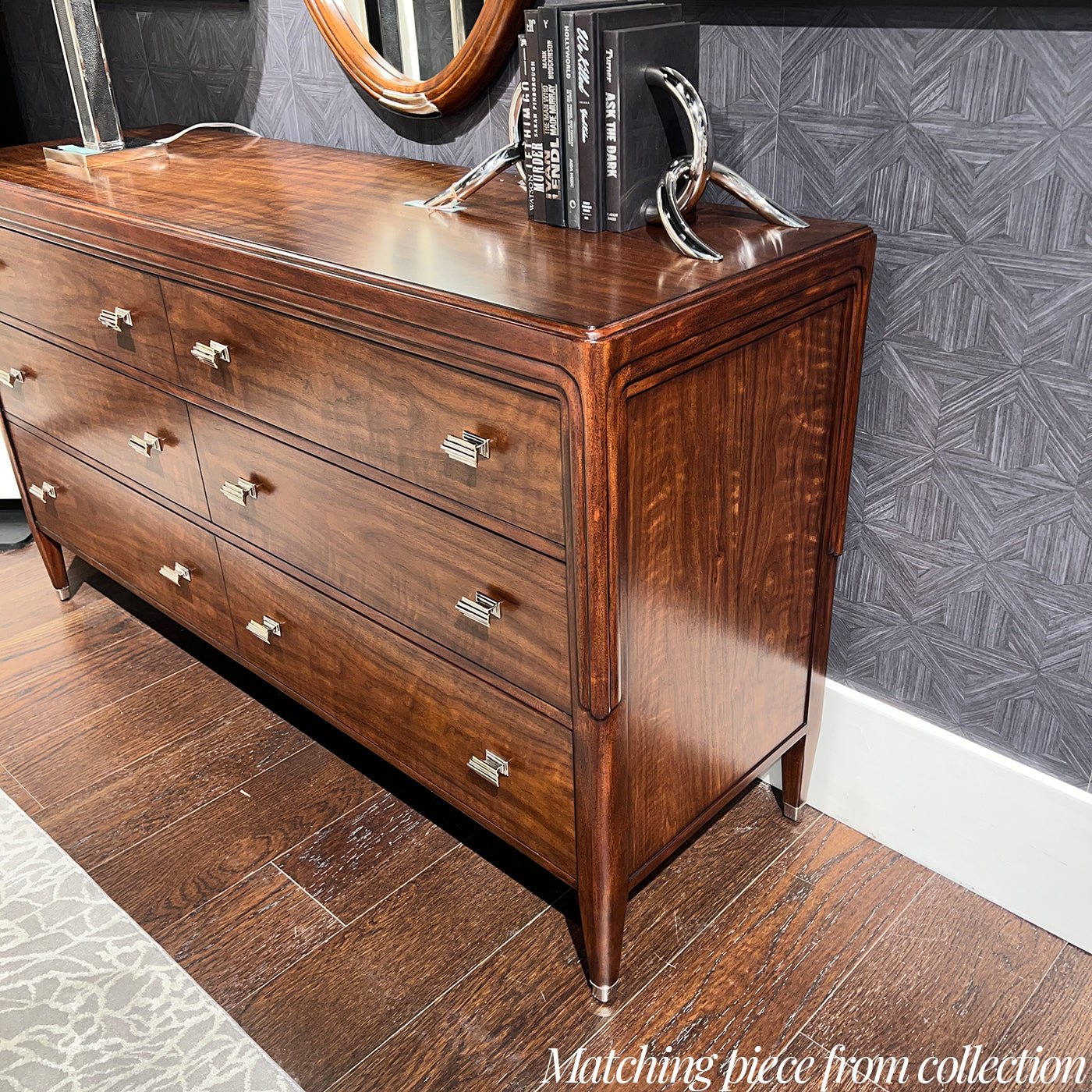 Walnut Art Deco dresser with decor, side view.