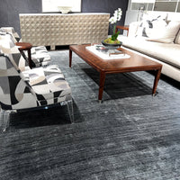 Walnut Art Deco coffee table in elegant seating area.