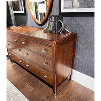 Close-up of walnut dresser, detailed grain, mounted decor.