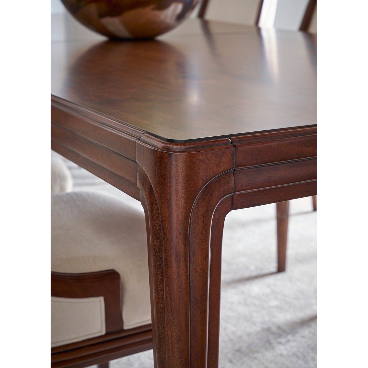 Walnut dining table corner joint, elegant design.