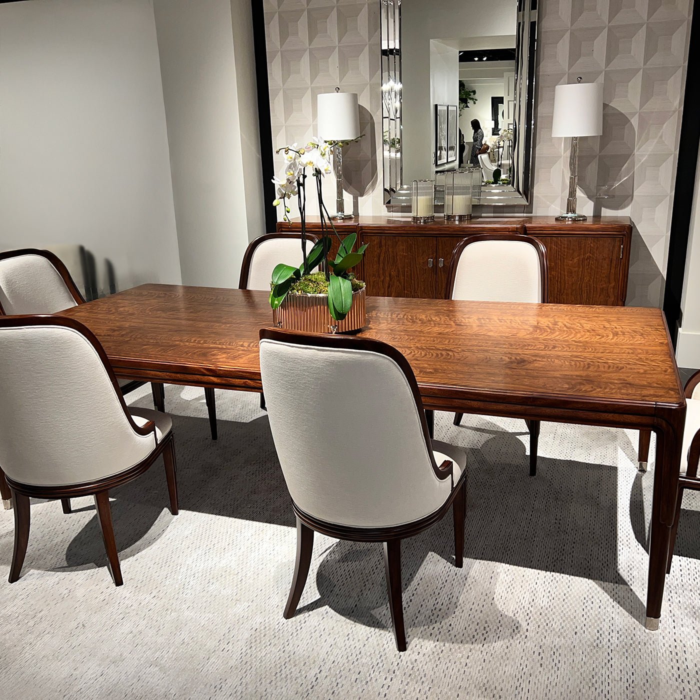Walnut dining table with chairs, stylish room decor.