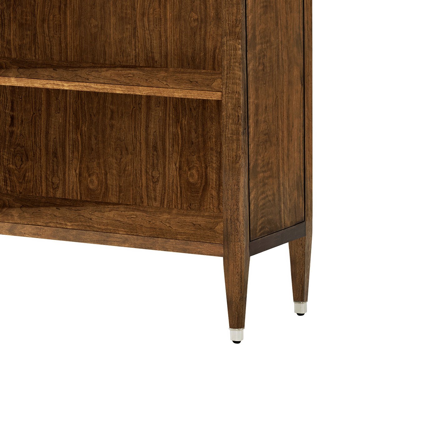 Close-up of walnut art deco bookcase legs and bottom shelf.