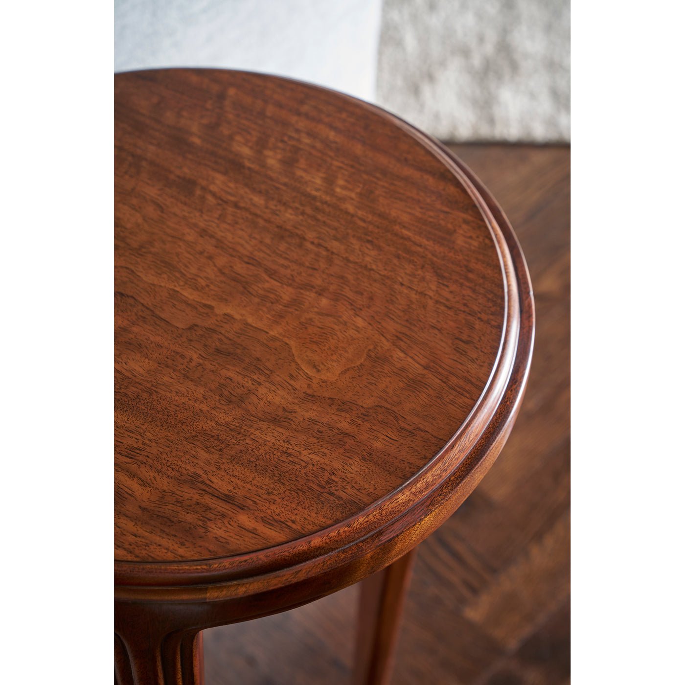 Close-up of tabletop on walnut art deco accent table.