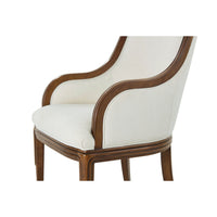 Detailed view of art deco dining chair arm and seat.