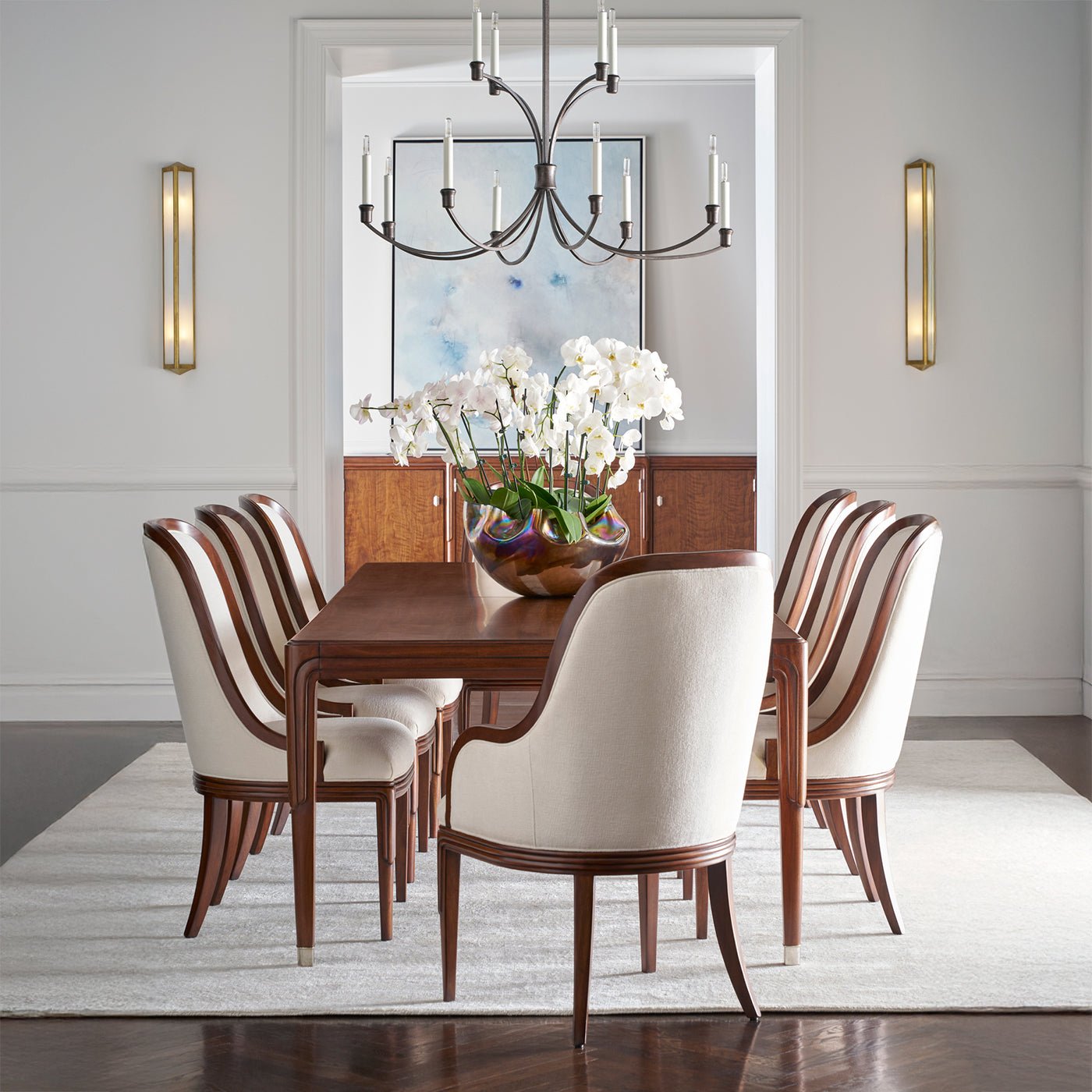 Dining room with art deco chairs around a table.