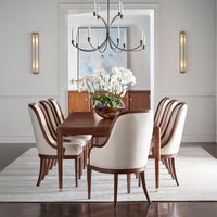 Dining room with art deco chairs around a table.