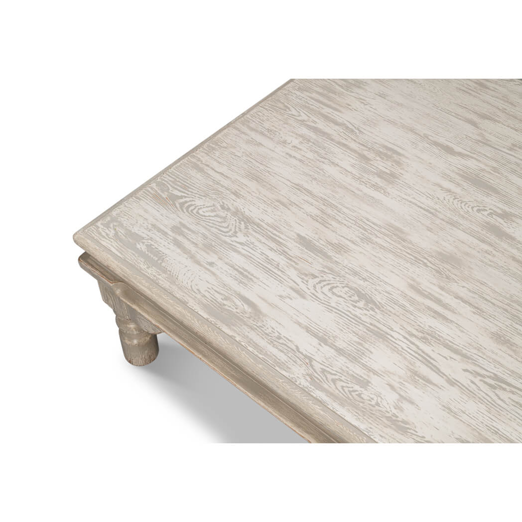 Close-up of table surface, washed gray finish.