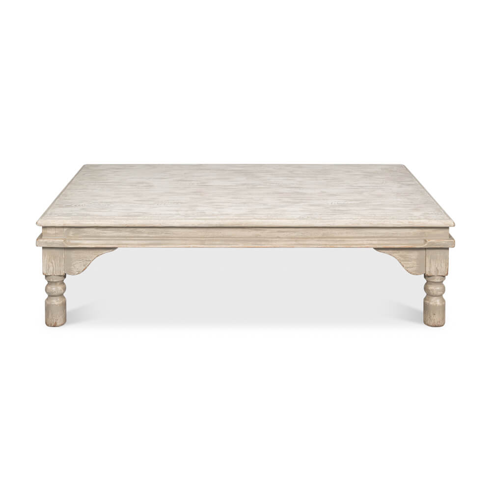 Front view of washed gray lowrise coffee table.