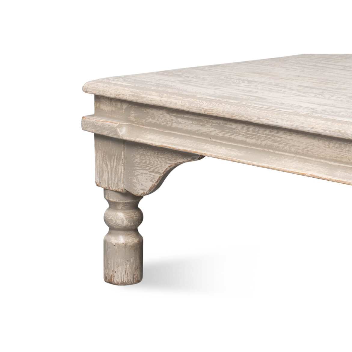 Close-up of table leg, washed gray coffee table.
