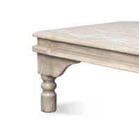 Close-up of table leg, washed gray coffee table.
