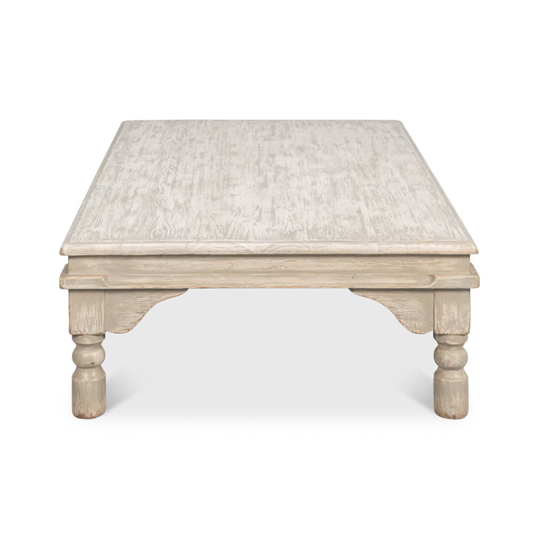 Side view of washed gray lowrise coffee table.