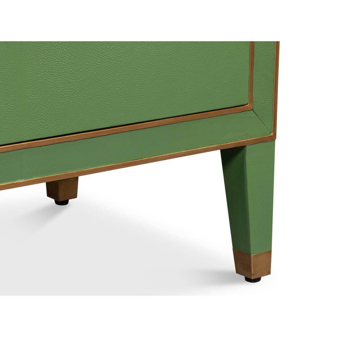 Green nightstand leg detail with metallic accents.
