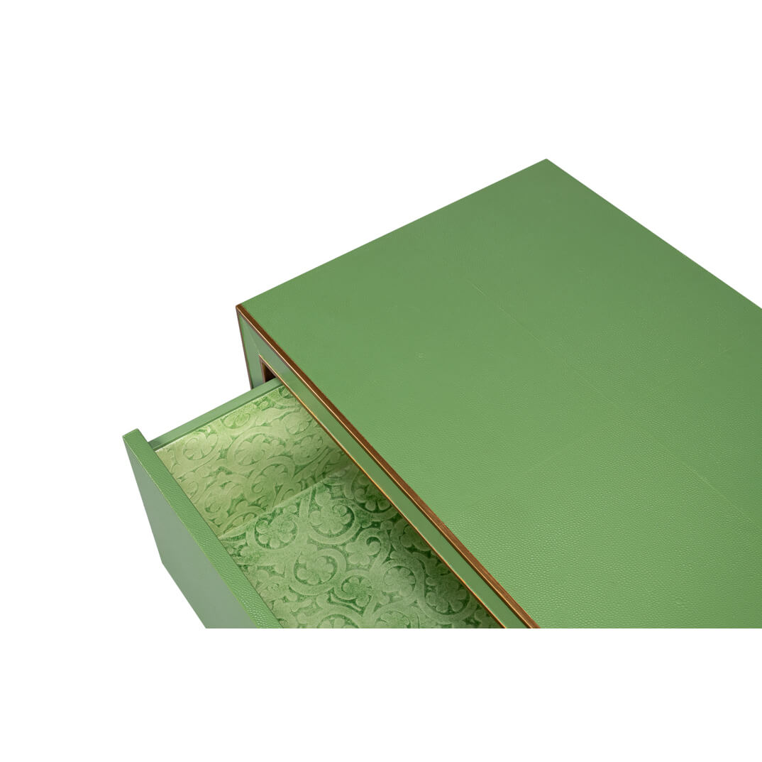 Open drawer with decorative lining, watercress green nightstand.