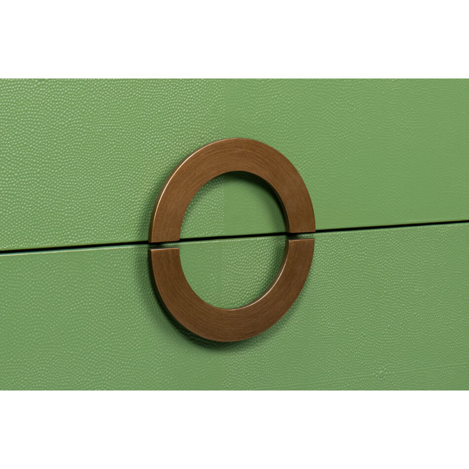 Close-up of circular handle on green nightstand.