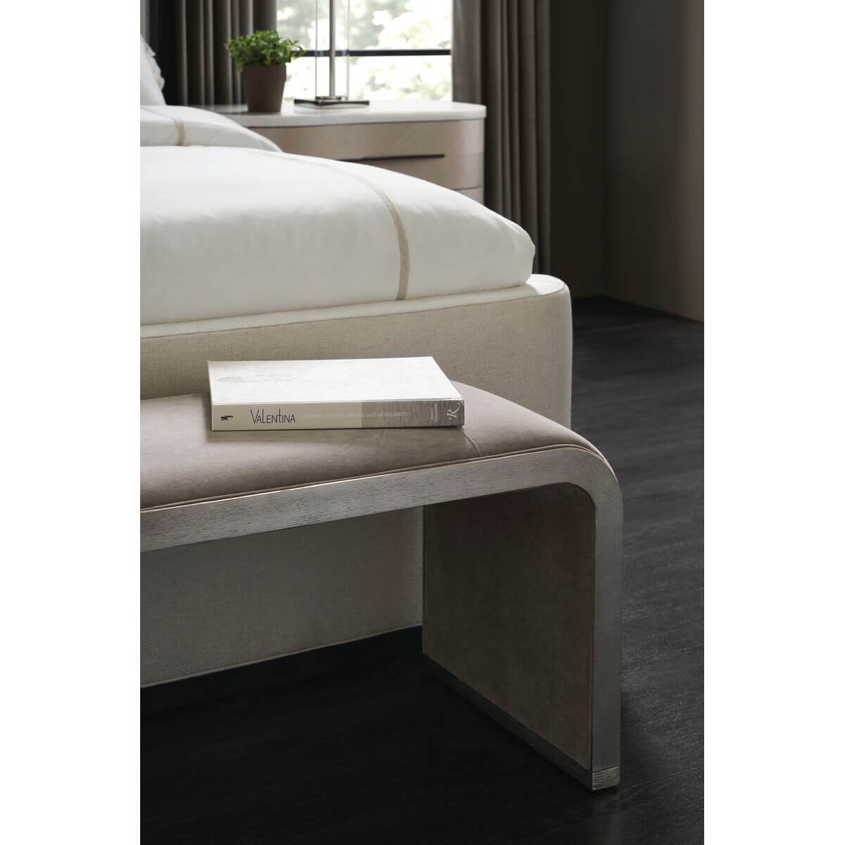 Waterfall velvet bench in elegant bedroom, book on top.