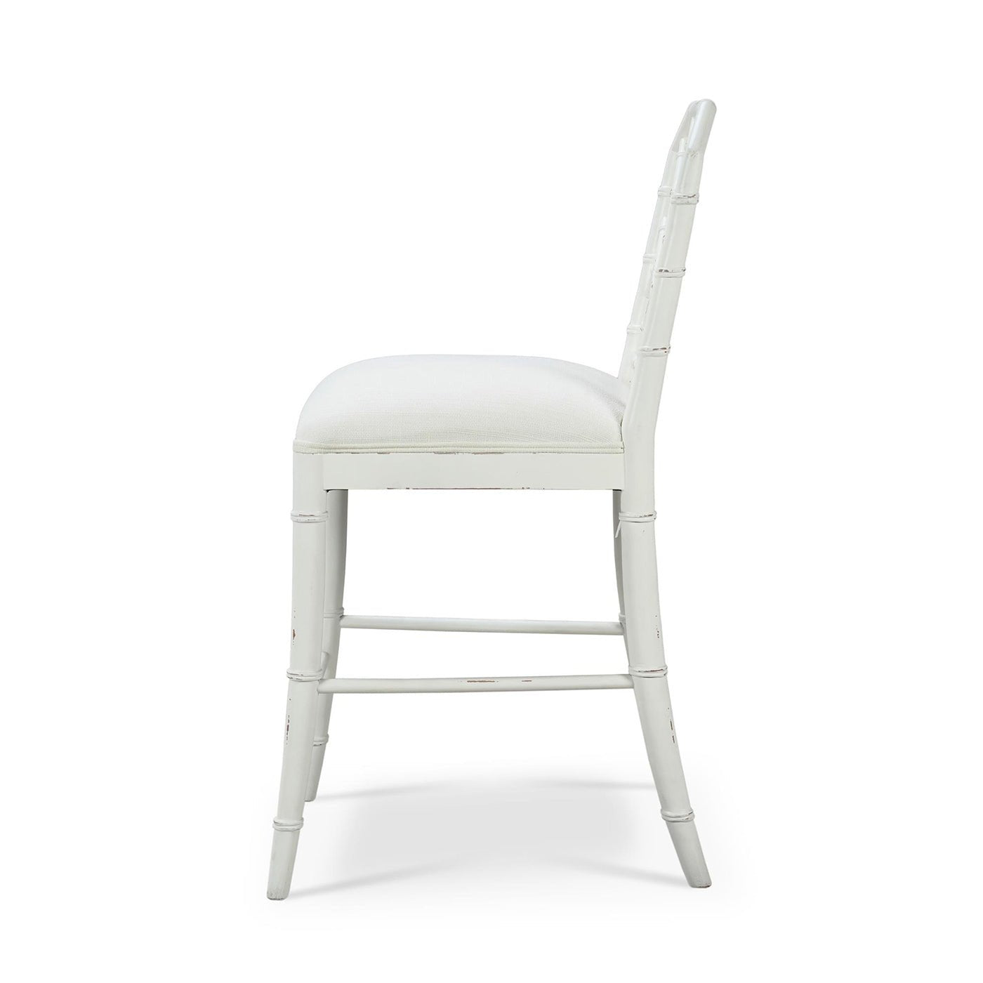 Side view of white Chippendale counter stool.