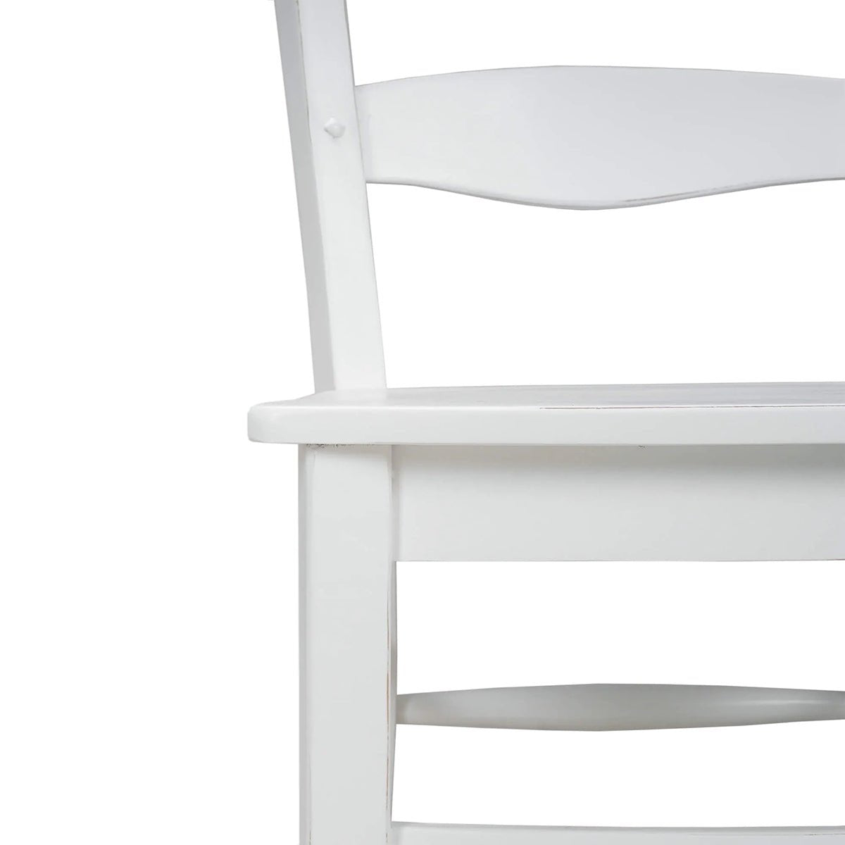 White dining chair close-up of seat and slats.