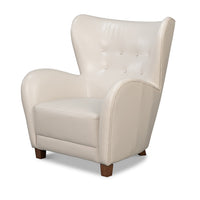 White leather wing chair front angle view.