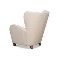 White leather wing chair back angle view.