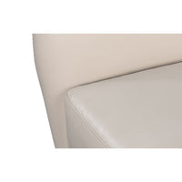 White leather wing chair cushion and side detail.