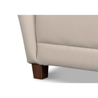 White leather wing chair wooden legs.