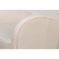 White leather wing chair armrest detail.